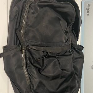 Lululemon black full size backpack. Used condition but still has life in it.